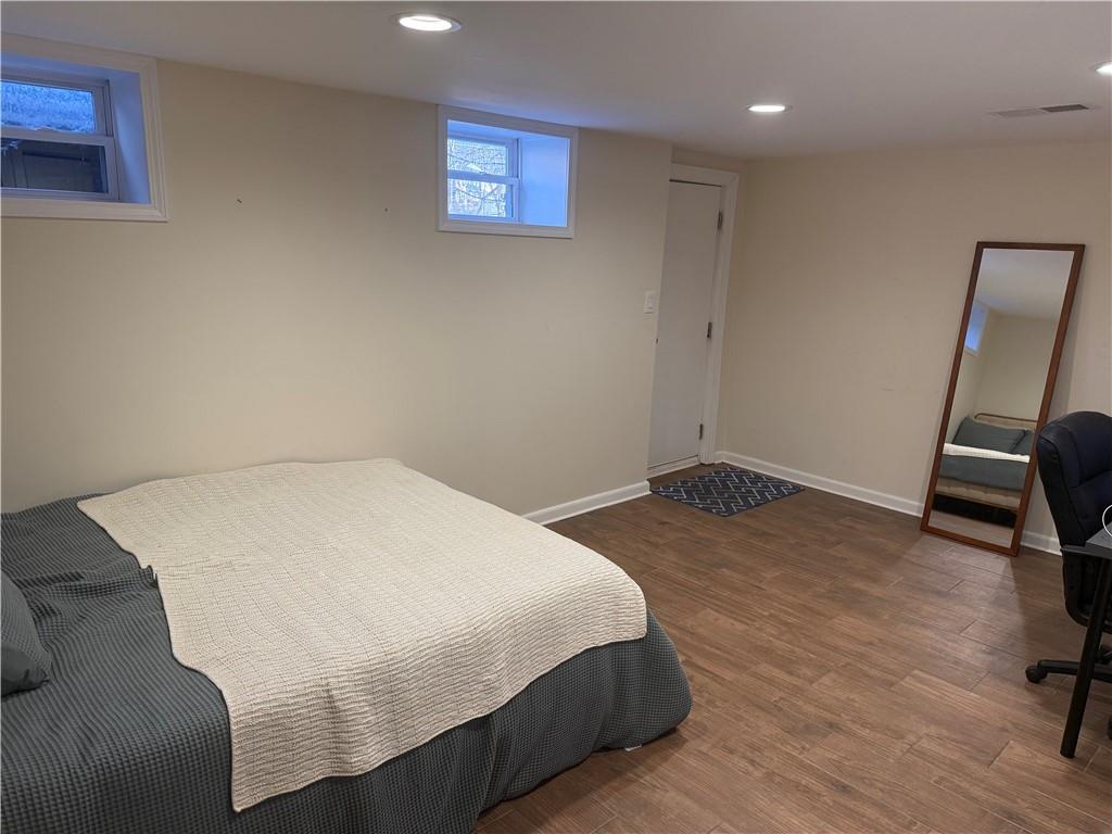 8131 Rowan Road Cranberry Township, PA 16066 - Photo 14 of 21 a bedroom with a bed and wooden floor