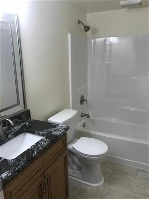 8131 Rowan Road Cranberry Township, PA 16066 - Photo 17 of 21 a bathroom with a granite countertop toilet sink and mirror