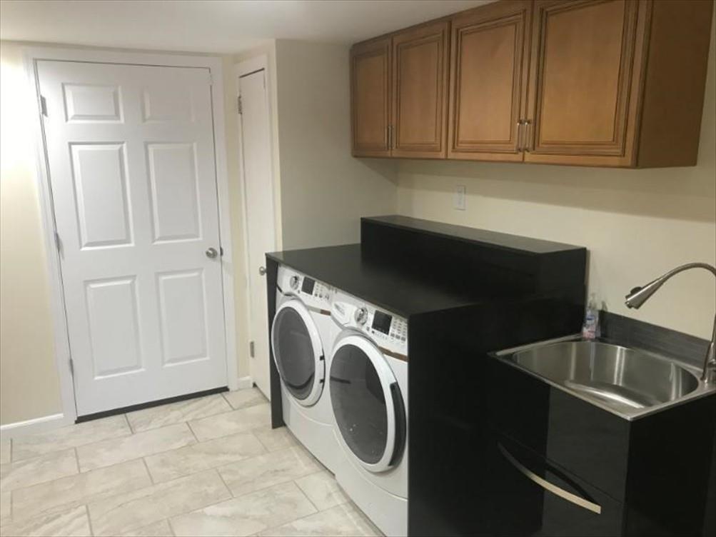 8131 Rowan Road Cranberry Township, PA 16066 - Photo 18 of 21 a utility room with sink dryer and washer