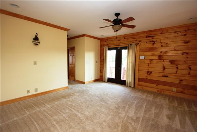 108 New Dawn Road Rockvale, TN 37153 - Photo 7 of 20 The master is downstairs and has French doors leading out to your wrap around porch. The his and her walk in closets and the upgraded master bath are perfect.