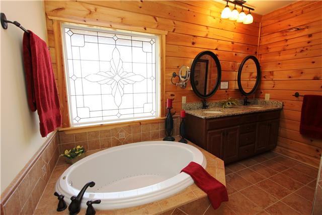 108 New Dawn Road Rockvale, TN 37153 - Photo 8 of 20 Master bath features a Jacuzzi tub, granite counter tops and a tiled shower with seat.