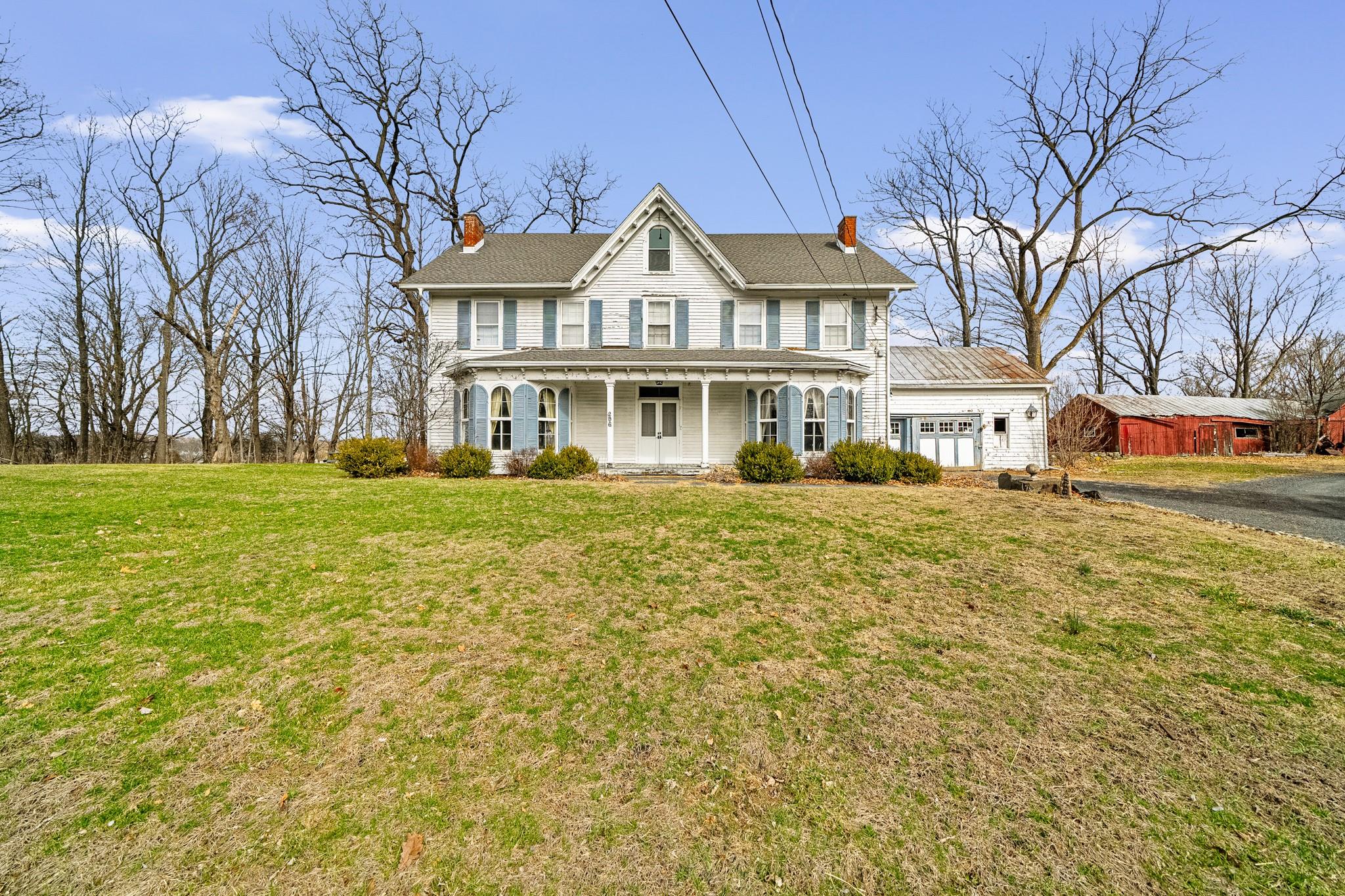206 Greycourt Road, Unit 190 Chester, NY 10918 - Photo 11 of 49 a front view of a building with a garden