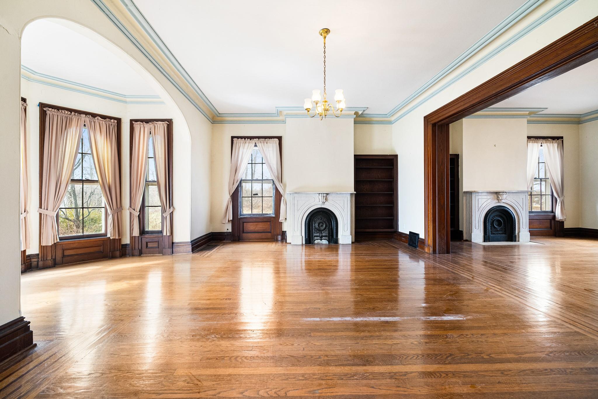 206 Greycourt Road, Unit 190 Chester, NY 10918 - Photo 22 of 49 a view of empty room with wooden floor and fireplace