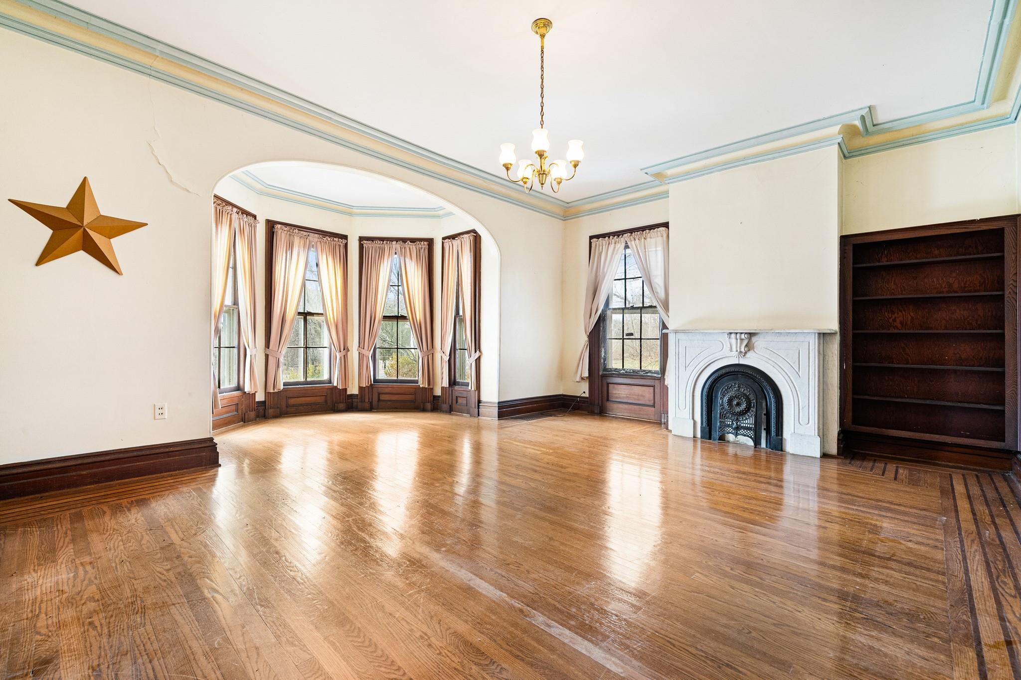 206 Greycourt Road, Unit 190 Chester, NY 10918 - Photo 23 of 49 a view of a livingroom with a fireplace wooden floor and windows