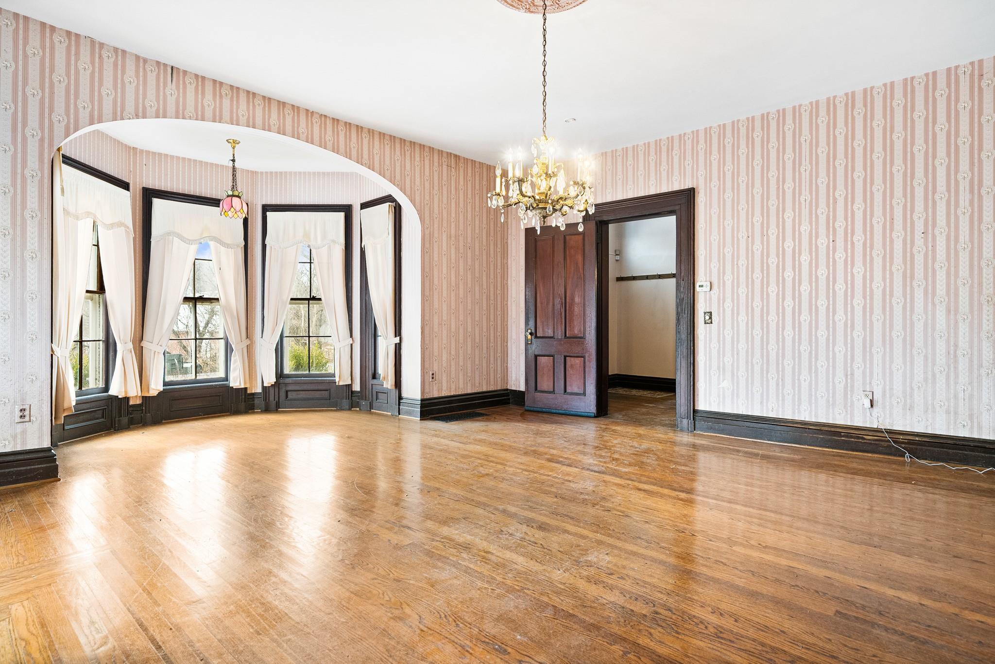 206 Greycourt Road, Unit 190 Chester, NY 10918 - Photo 33 of 49 a view of an empty room with wooden floor and windows