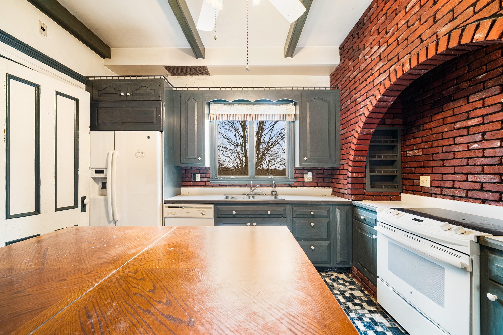 206 Greycourt Road, Unit 190 Chester, NY 10918 - Photo 35 of 49 a large white kitchen with a sink a refrigerator and a stove