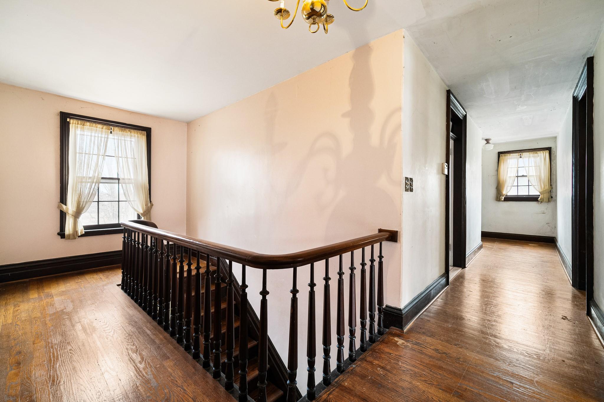 206 Greycourt Road, Unit 190 Chester, NY 10918 - Photo 39 of 49 a view of a hallway with wooden floor and stairs