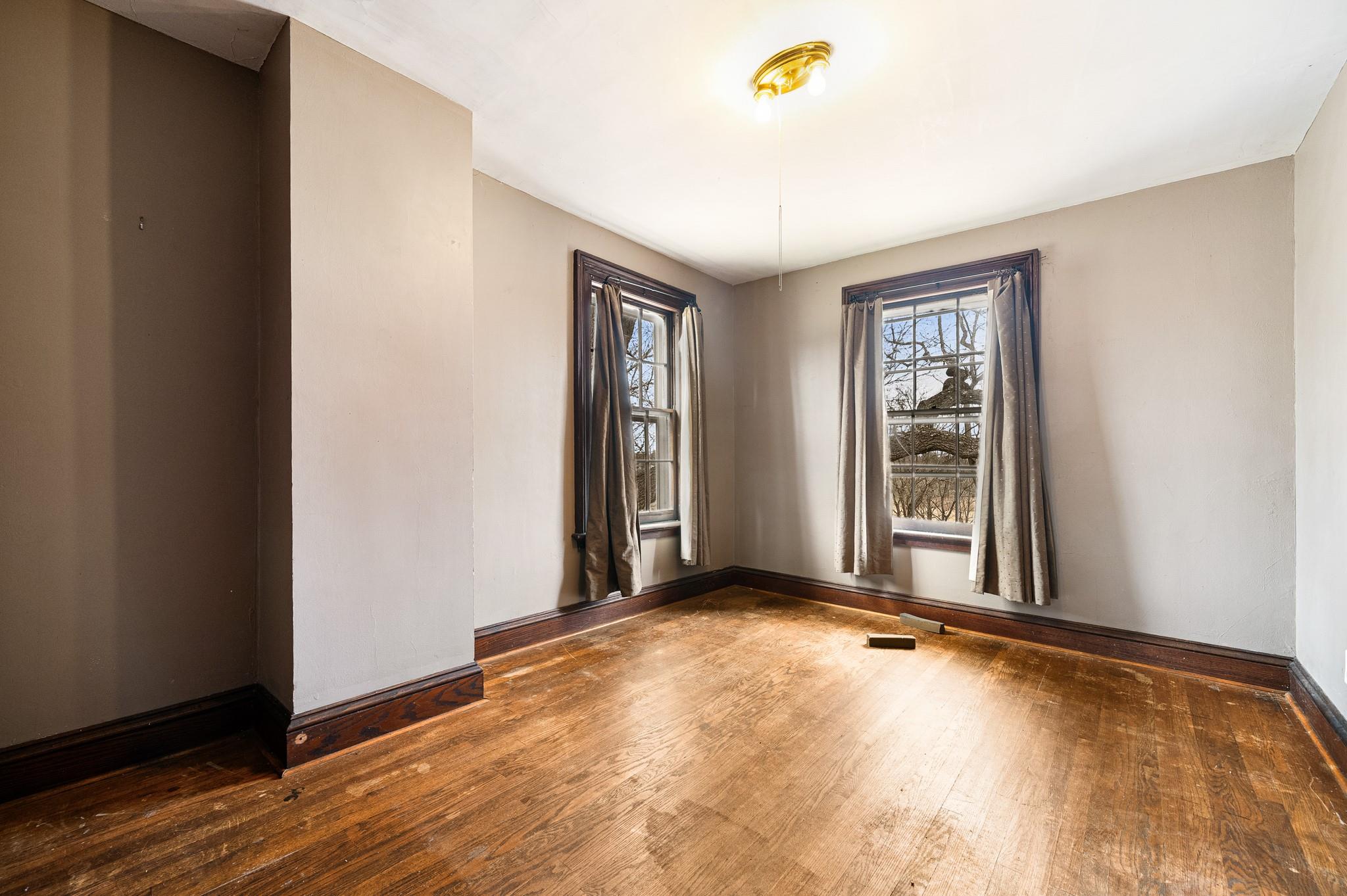206 Greycourt Road, Unit 190 Chester, NY 10918 - Photo 47 of 49 an empty room with wooden floor and windows