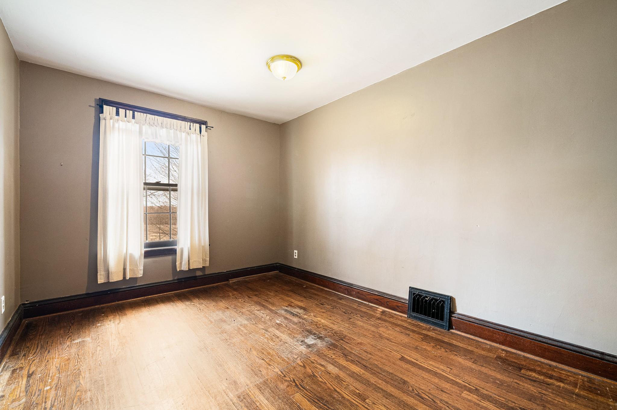 206 Greycourt Road, Unit 190 Chester, NY 10918 - Photo 48 of 49 a view of an empty room with wooden floor and a window