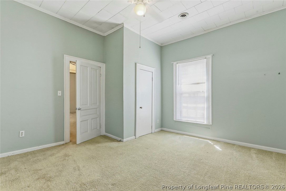 249 Nicholson Road Rockingham, NC 28379 - Photo 12 of 47 an empty room with windows and closet