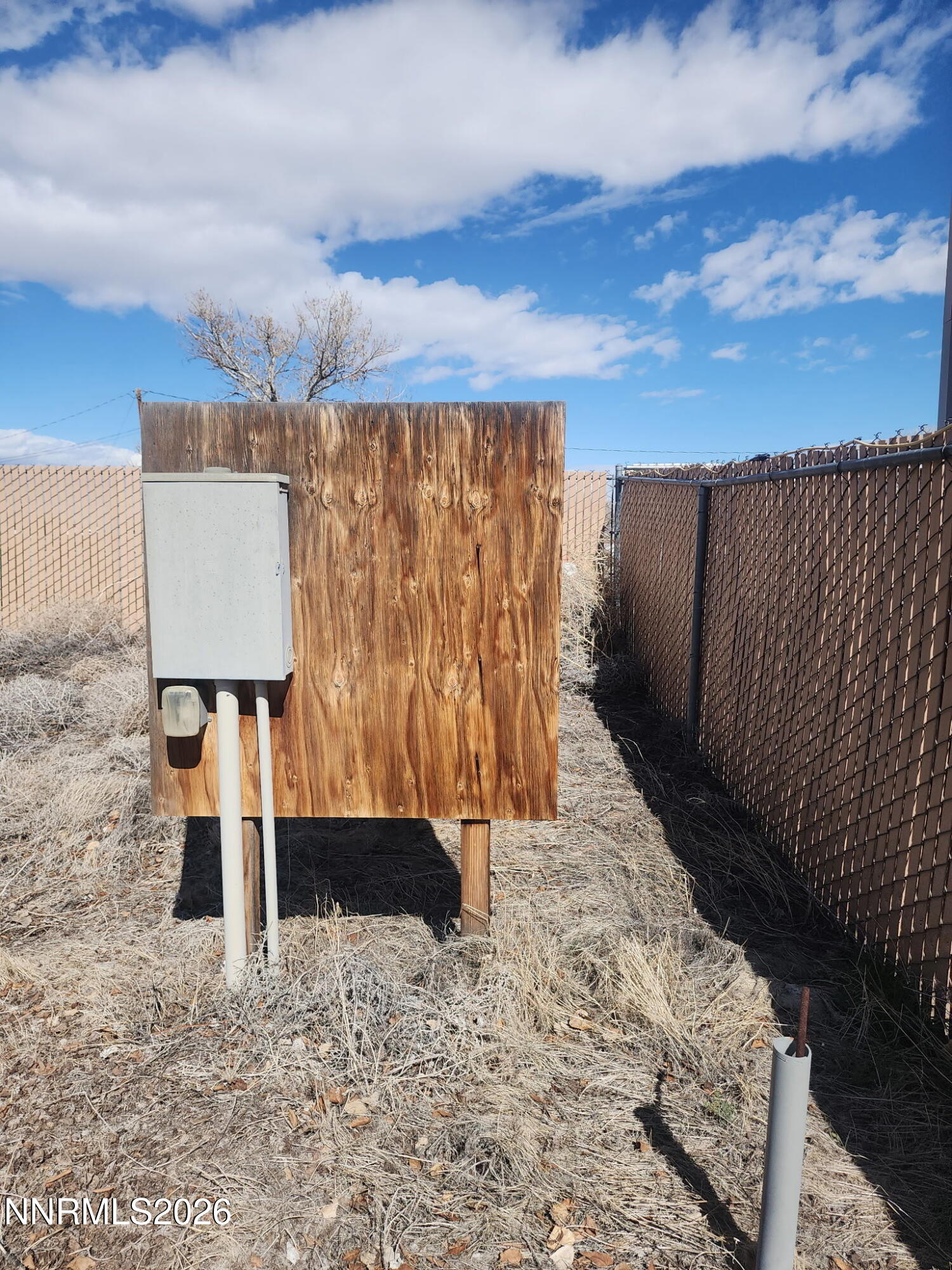 601 Windmill Drive Fallon, NV 89406 - Photo 12 of 18 a view of water heater with wooden fence