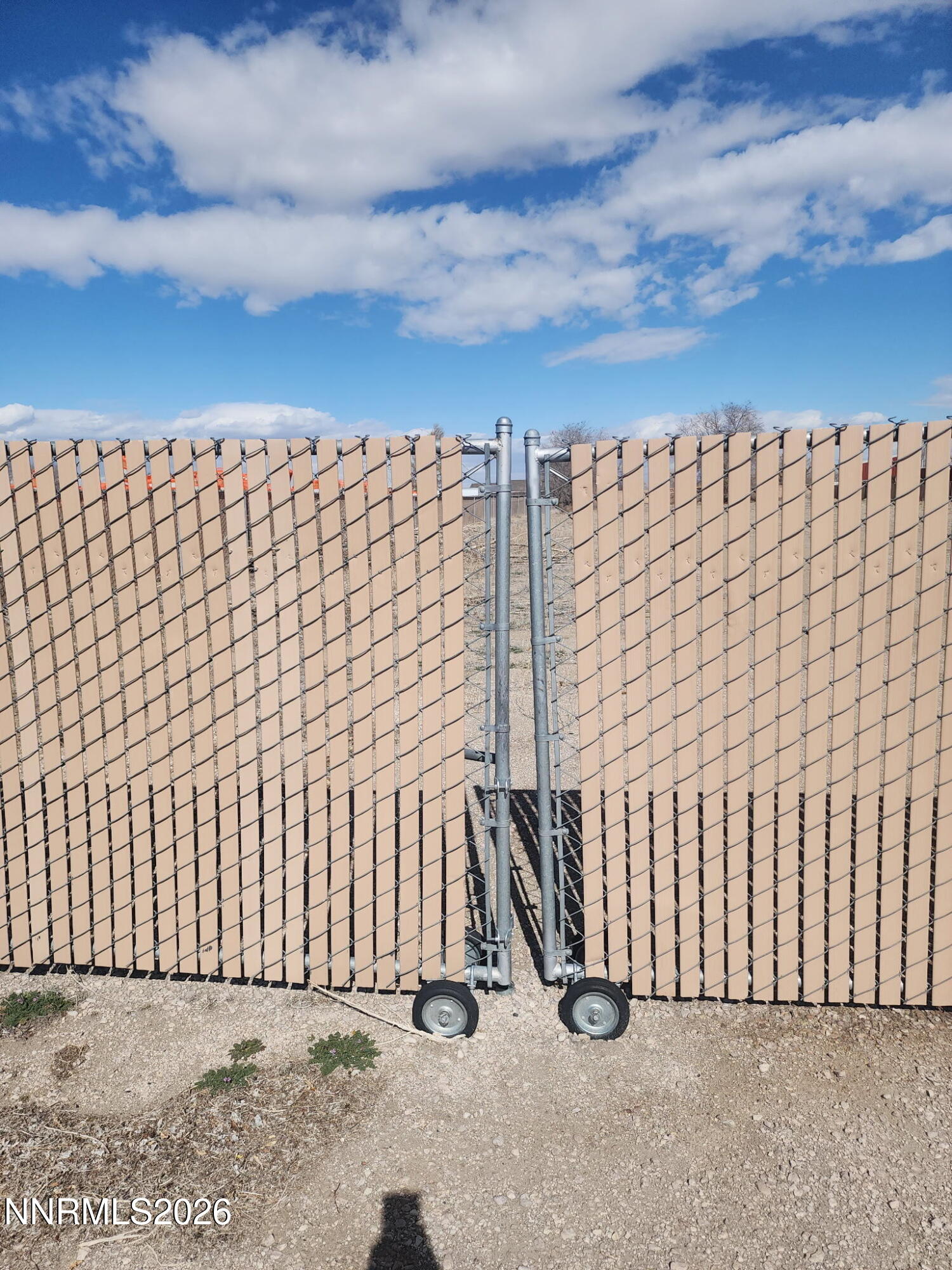 601 Windmill Drive Fallon, NV 89406 - Photo 17 of 18 a view of a building with wooden fence