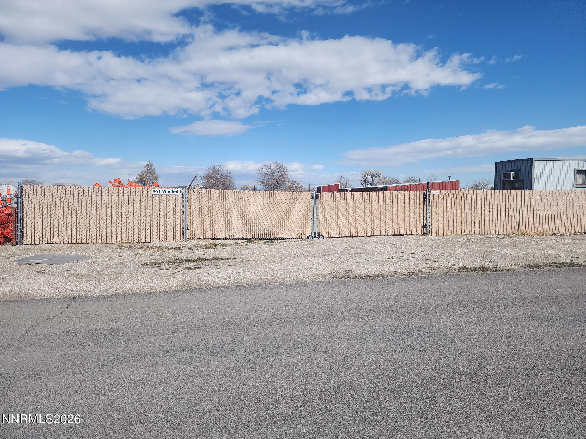 601 Windmill Drive Fallon, NV 89406 - Photo 18 of 18 a view of white house with snow on the side of the road
