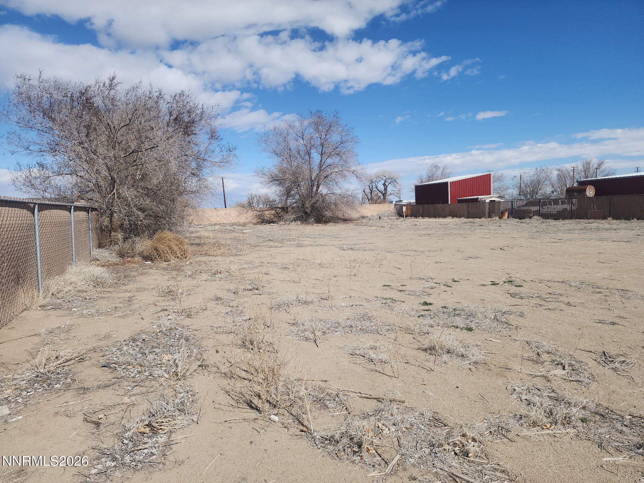601 Windmill Drive Fallon, NV 89406 - Photo 3 of 18 a view of a dry yard covered with snow