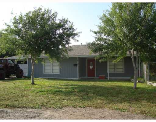 a view of a house that has a backyard