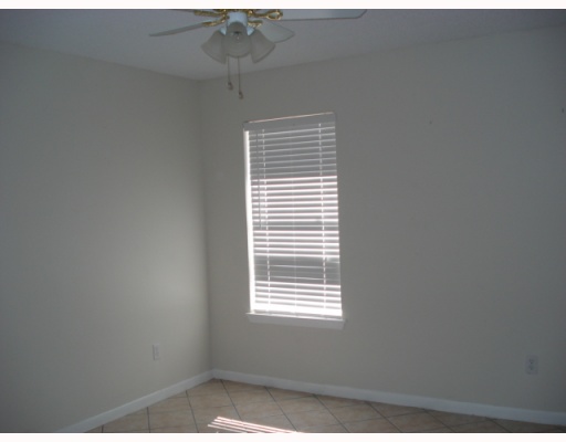 812 Lawrence Street Portland, TX 78374 - Photo 7 of 10 a view of an empty room with a window