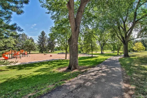 a view of backyard with large trees