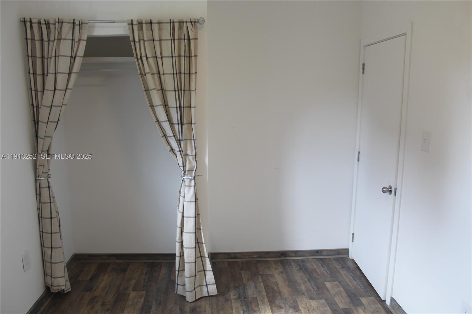 19879 Southwest 328th Street, Unit 2 Homestead, FL 33030 - Photo 11 of 20 a view of entryway with wooden floor