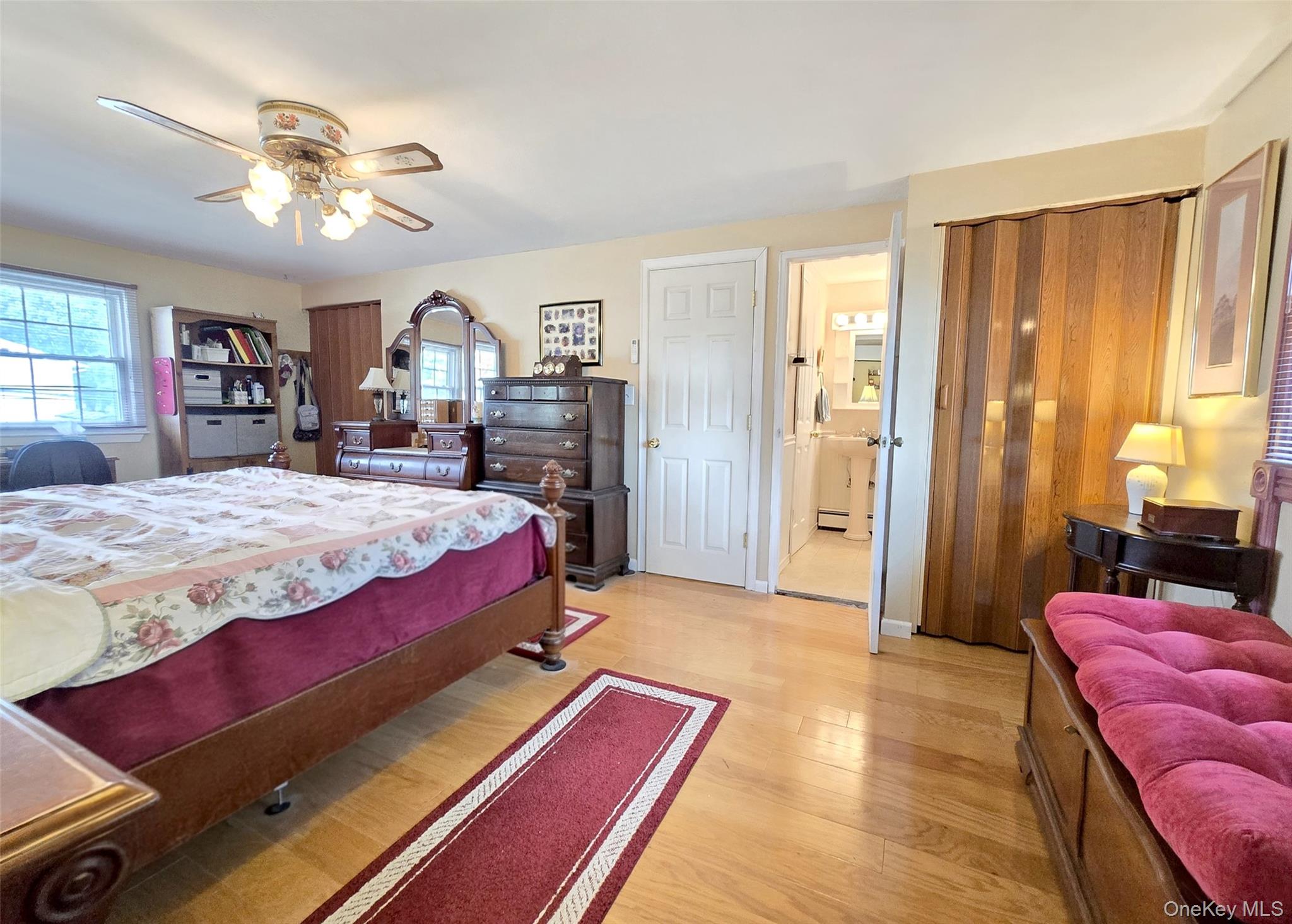 8 Corvette Road Selden, NY 11784 - Photo 13 of 21 a bed room with a bed and a chandelier