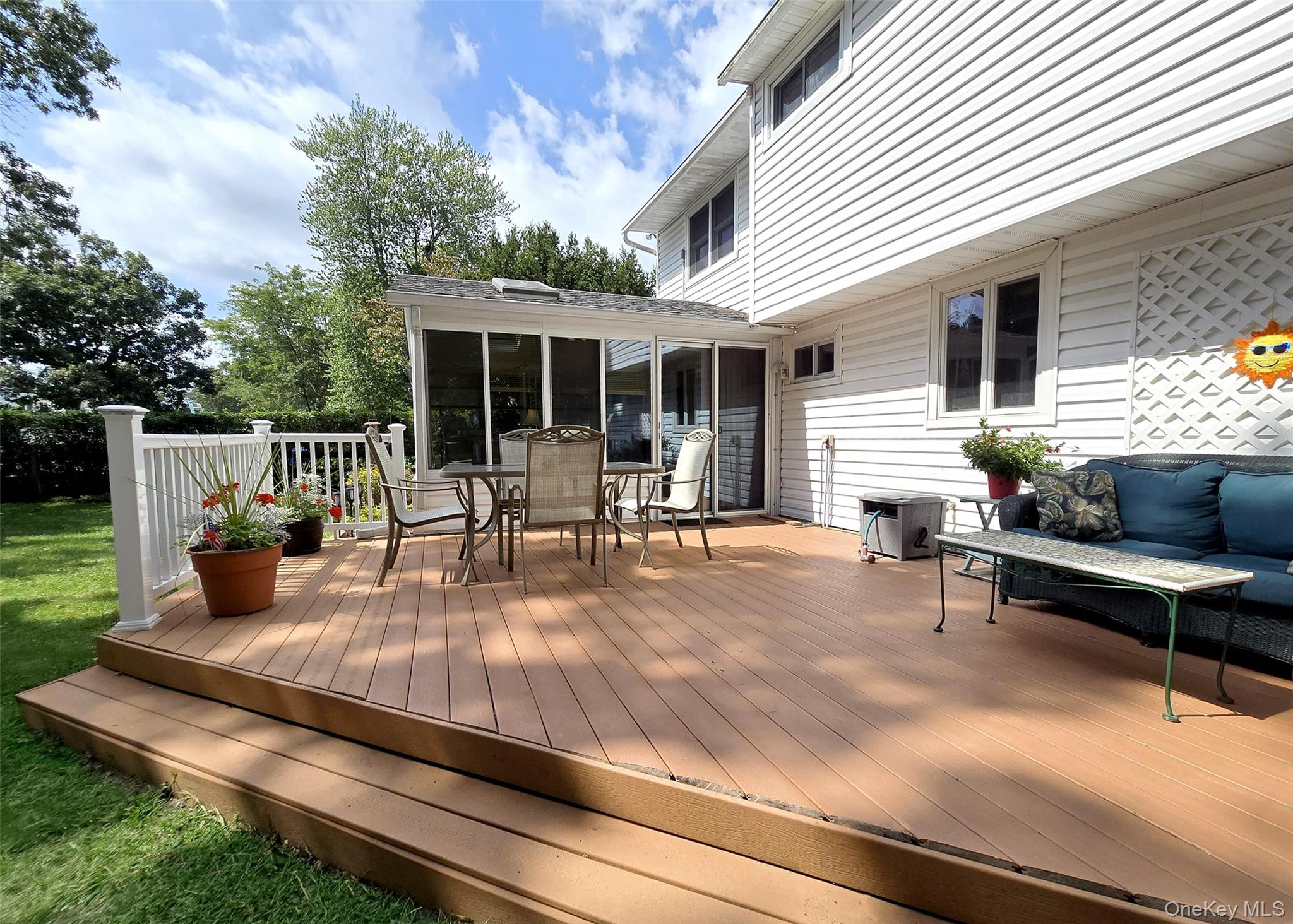 8 Corvette Road Selden, NY 11784 - Photo 18 of 21 a view of a house with backyard and sitting area