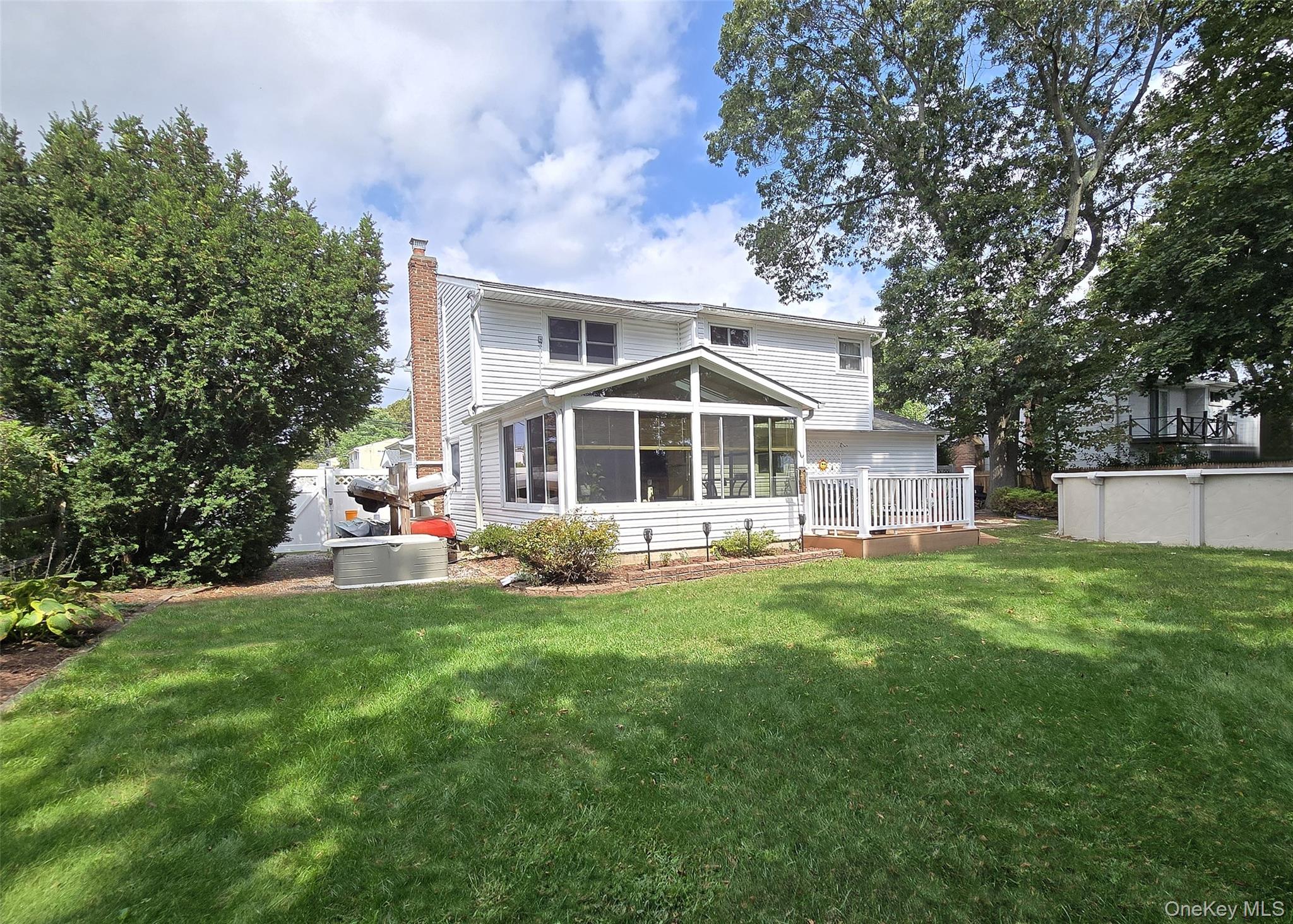 8 Corvette Road Selden, NY 11784 - Photo 19 of 21 a front view of a house with a yard