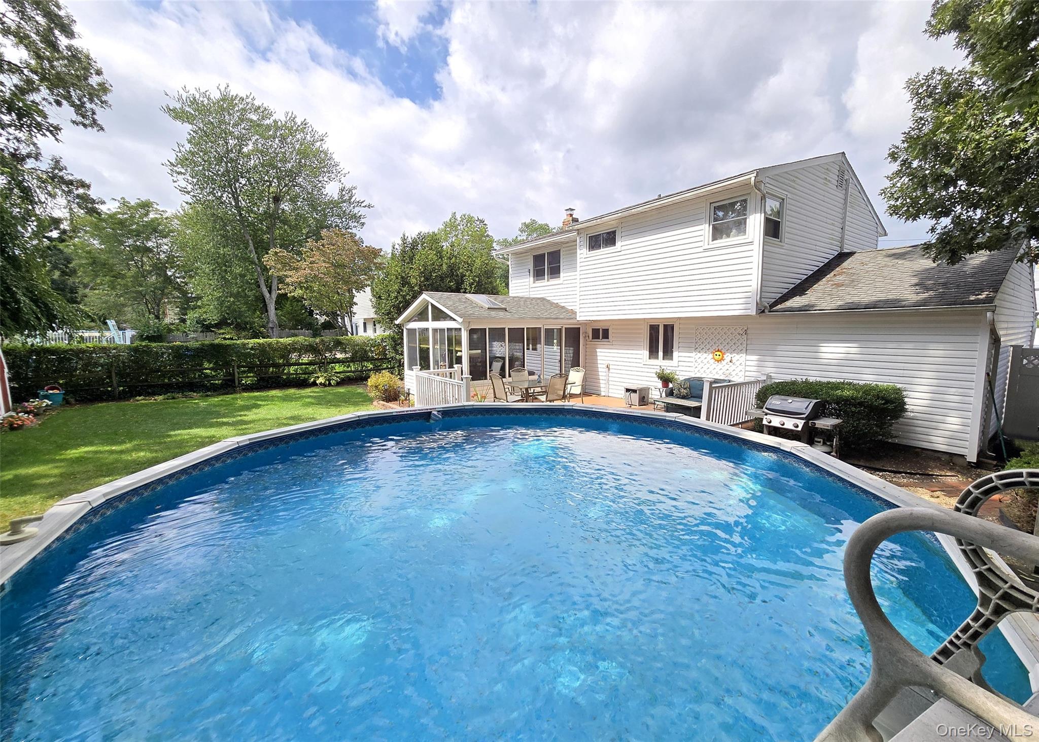 8 Corvette Road Selden, NY 11784 - Photo 20 of 21 a view of a house with backyard and sitting area
