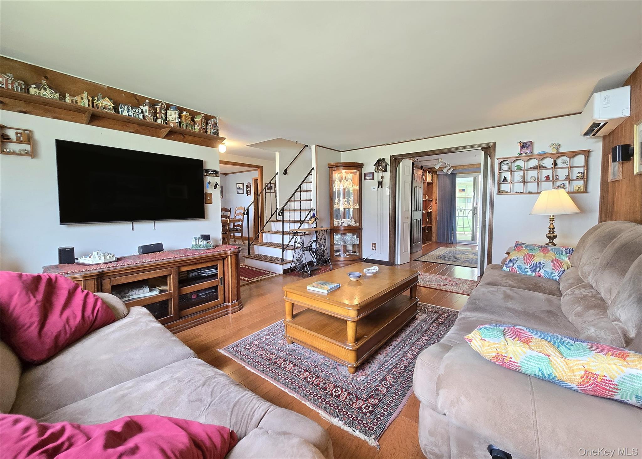 8 Corvette Road Selden, NY 11784 - Photo 3 of 21 a living room with furniture and a flat screen tv