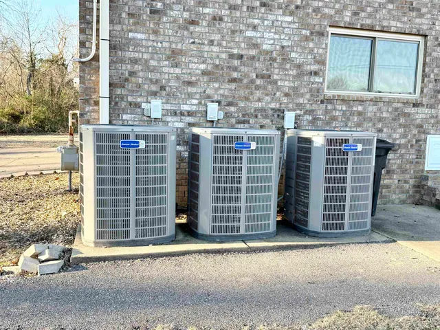 wooden floor fireplace and windows in a room