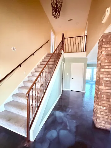 a kitchen with stainless steel appliances granite countertop a sink and cabinets