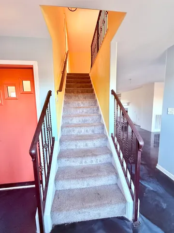 a view of hallway with stairs