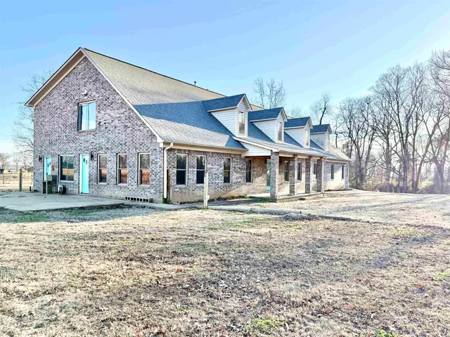 a front view of a house with a yard