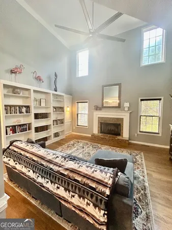 a living room with furniture and a fireplace