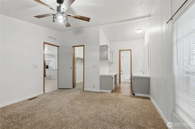 a bathroom with a double vanity sink and mirror