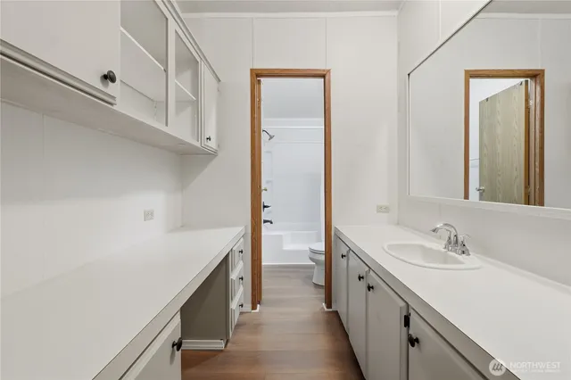 a bathroom with a shower and a toilet