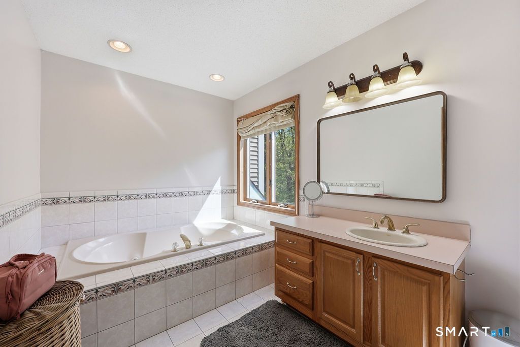 12 Forest Ridge Road Prospect, CT 06712 - Photo 23 of 40 a bathroom with a tub sink and mirror