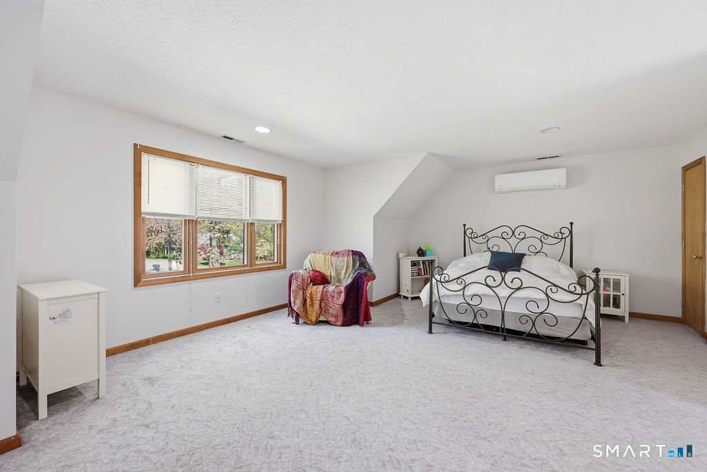 12 Forest Ridge Road Prospect, CT 06712 - Photo 25 of 40 a spacious bedroom with a bed and a window