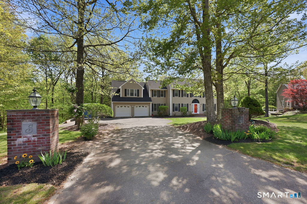 12 Forest Ridge Road Prospect, CT 06712 - Photo 4 of 40 a front view of a house with a garden and trees