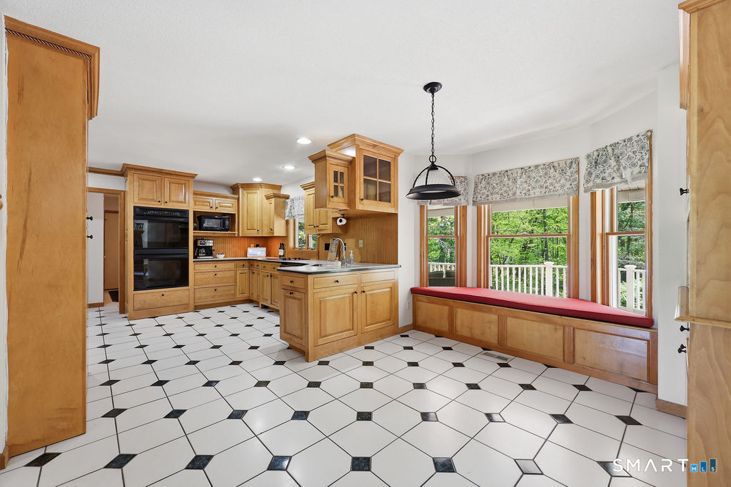 12 Forest Ridge Road Prospect, CT 06712 - Photo 5 of 40 a kitchen with granite countertop a refrigerator and a sink