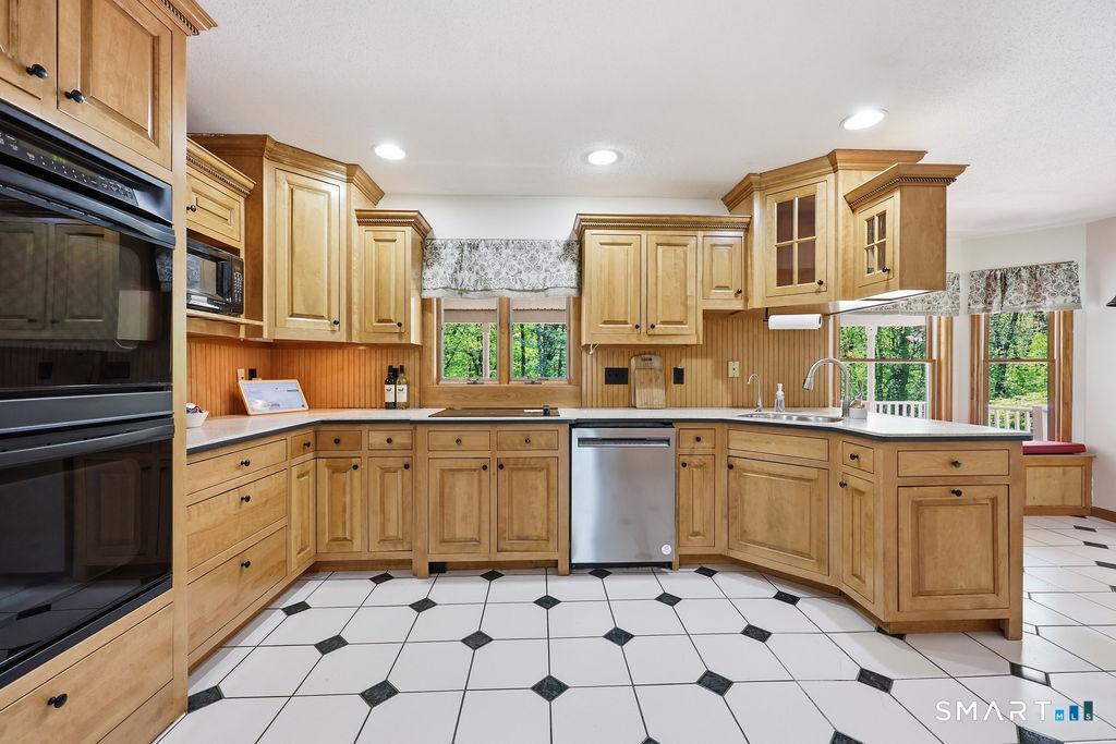 12 Forest Ridge Road Prospect, CT 06712 - Photo 6 of 40 a kitchen with stainless steel appliances granite countertop a sink and cabinets