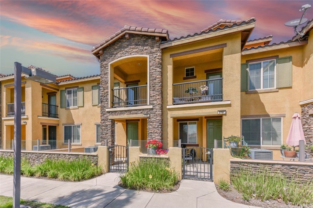 8755 Olive Tree Drive Rancho Cucamonga, CA 91730 - Photo 1 of 1 front view of a brick house with a yard