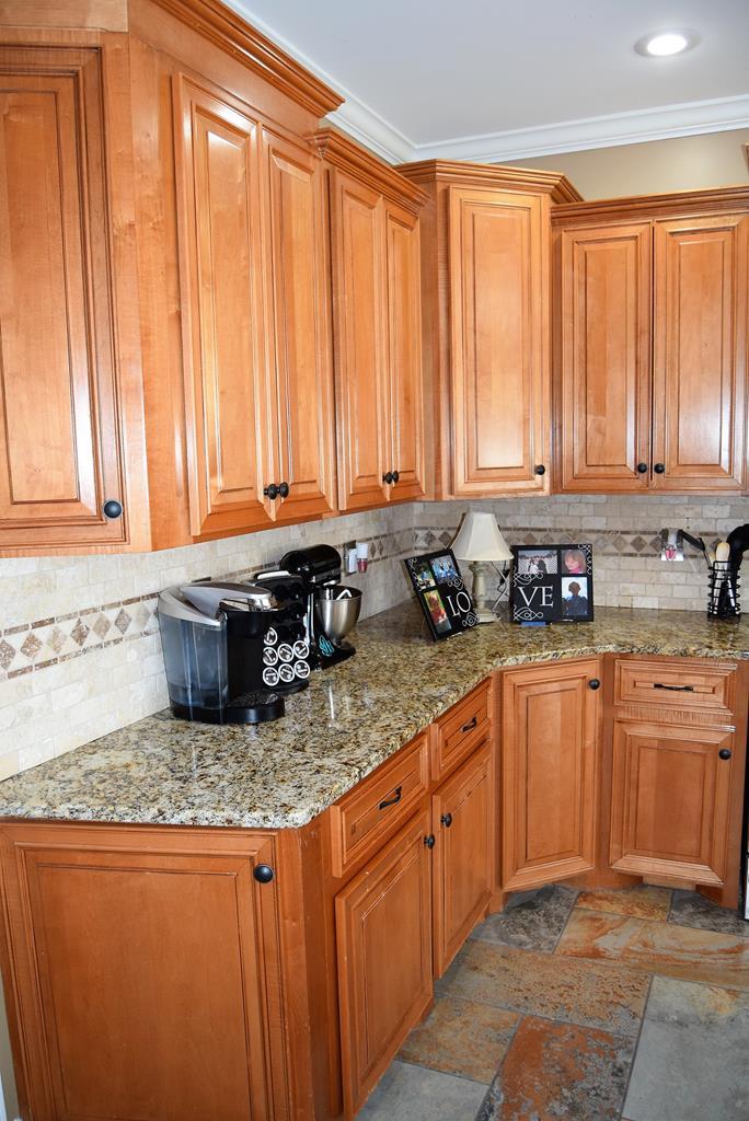 781 McKay Road Gray, GA 31032 - Photo 14 of 36 a kitchen with stainless steel appliances granite countertop a sink a window and a counter space
