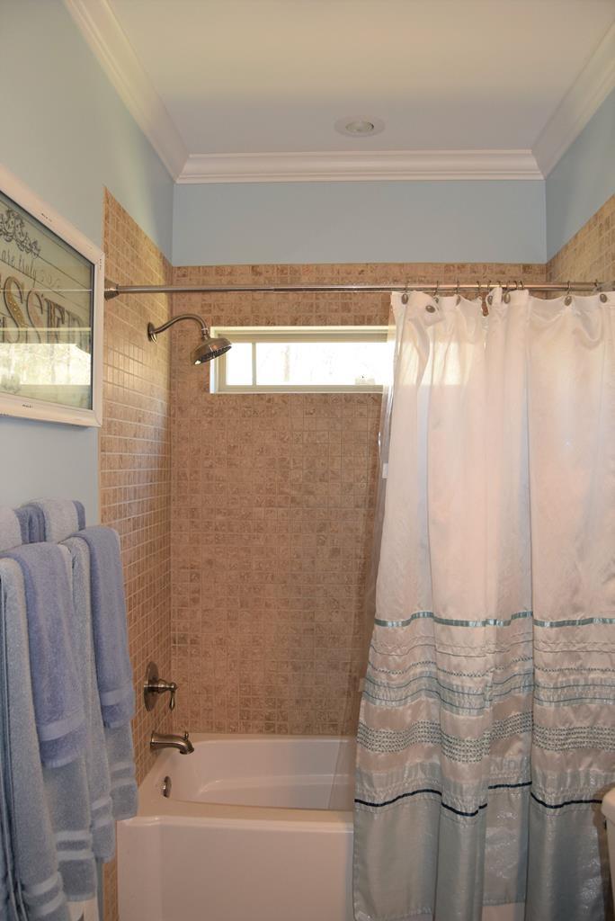 781 McKay Road Gray, GA 31032 - Photo 17 of 36 a bathroom with a shower and a tub