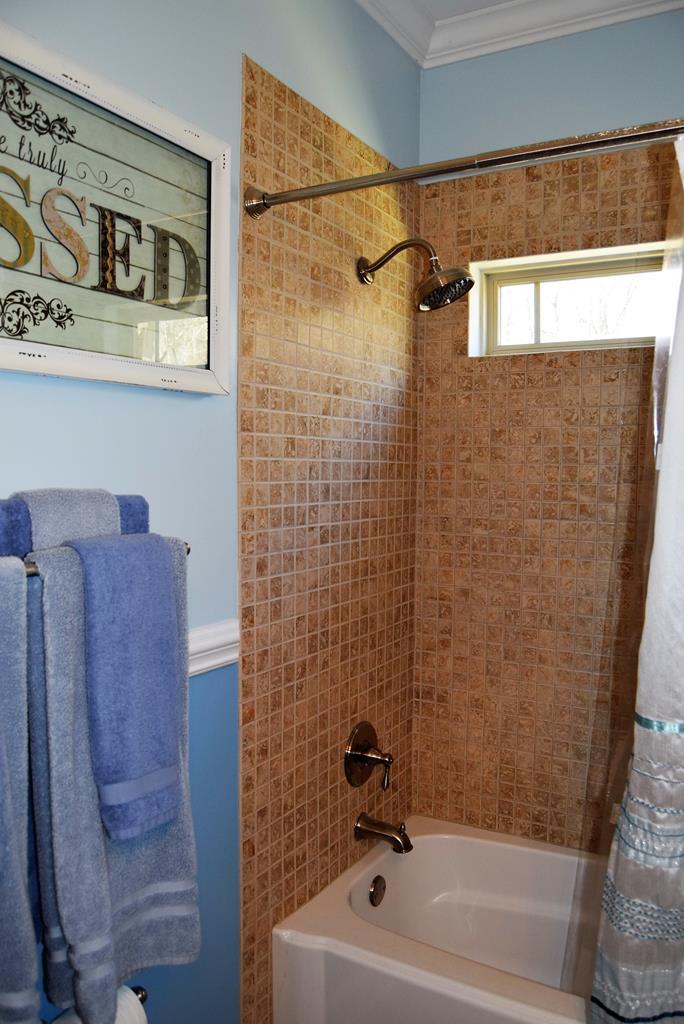 781 McKay Road Gray, GA 31032 - Photo 18 of 36 a bathroom with a shower and a sink