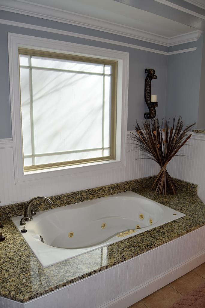 781 McKay Road Gray, GA 31032 - Photo 21 of 36 a bath tub sitting next to a window