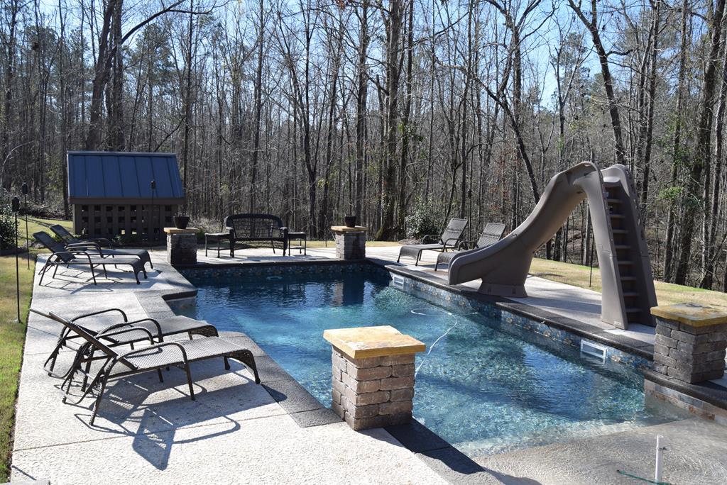 781 McKay Road Gray, GA 31032 - Photo 30 of 36 a view of a backyard with swimming pool