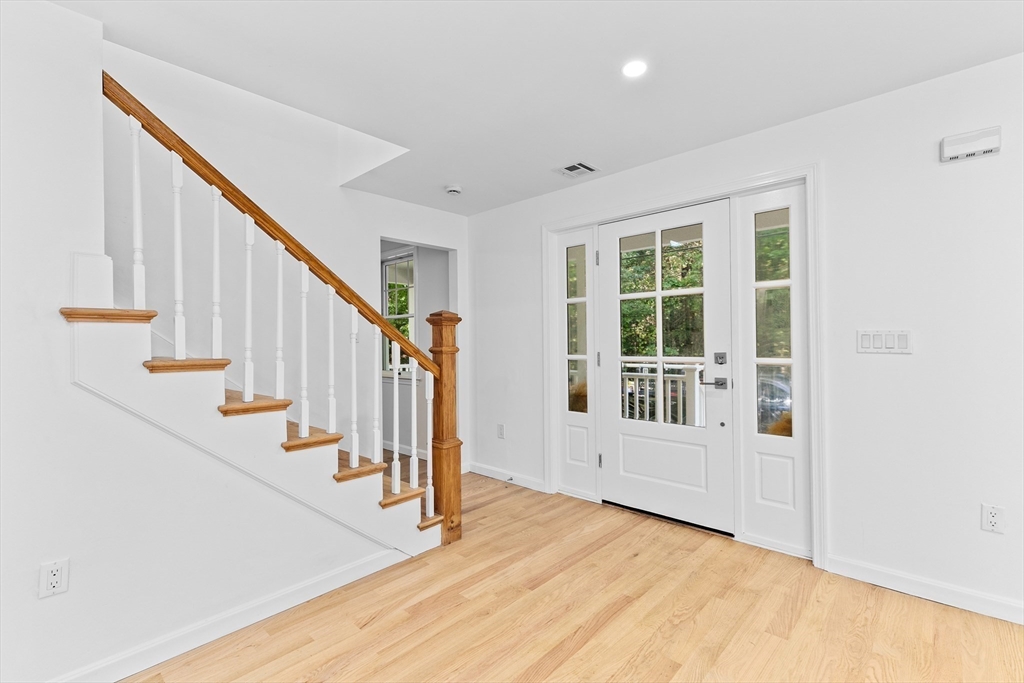 22 Clifford Court Hingham, MA 02043 - Photo 11 of 26 a view of an entryway with wooden floor and door