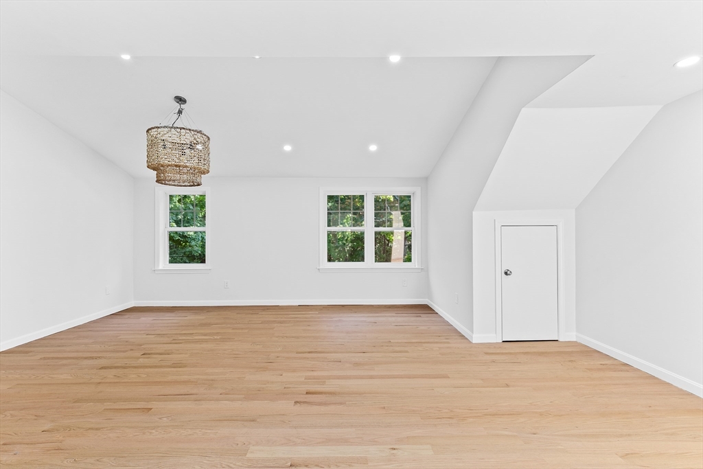 22 Clifford Court Hingham, MA 02043 - Photo 13 of 26 a view of an empty room with window and wooden floor