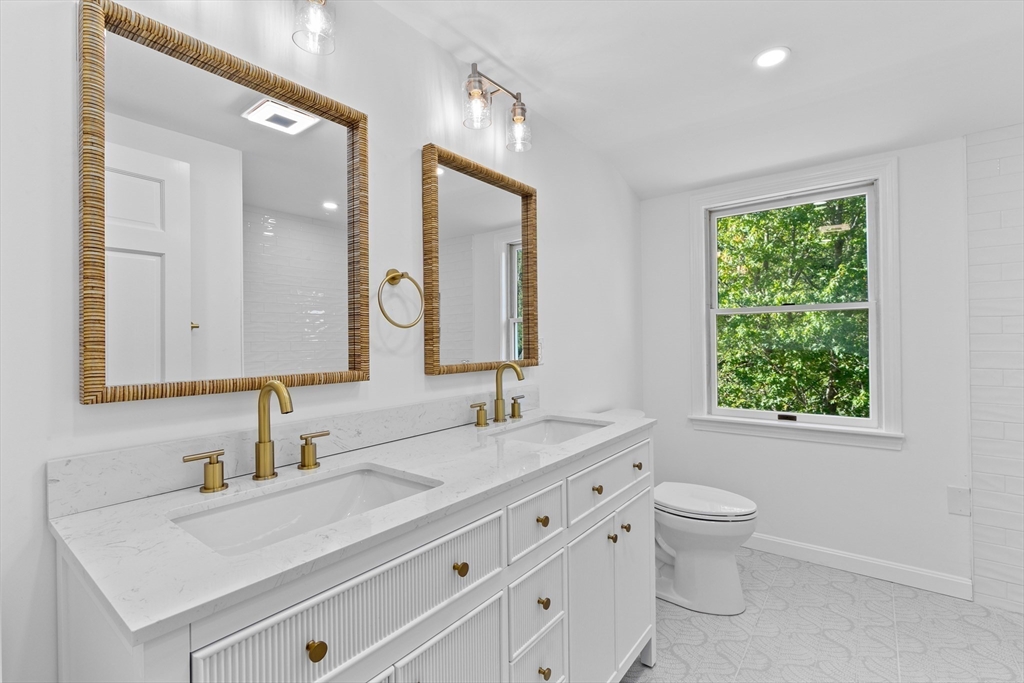 22 Clifford Court Hingham, MA 02043 - Photo 14 of 26 a bathroom with a double vanity sink toilet and a mirror