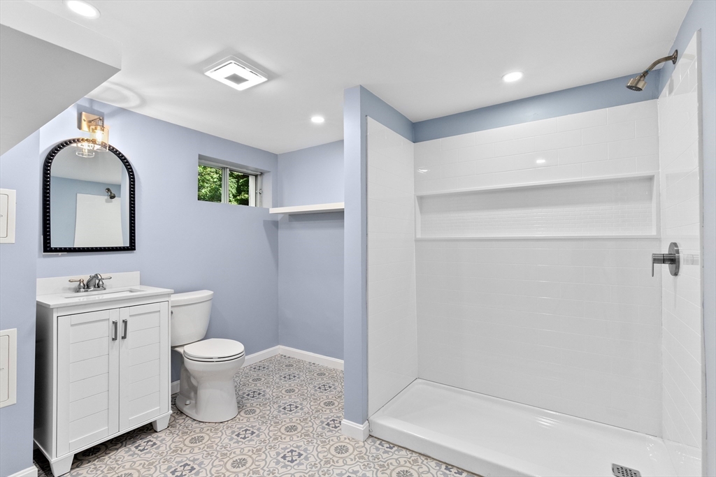 22 Clifford Court Hingham, MA 02043 - Photo 21 of 26 a bathroom with a toilet sink and mirror