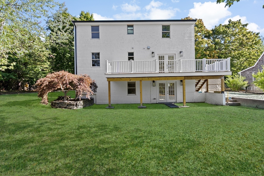 22 Clifford Court Hingham, MA 02043 - Photo 23 of 26 a front view of a house with garden